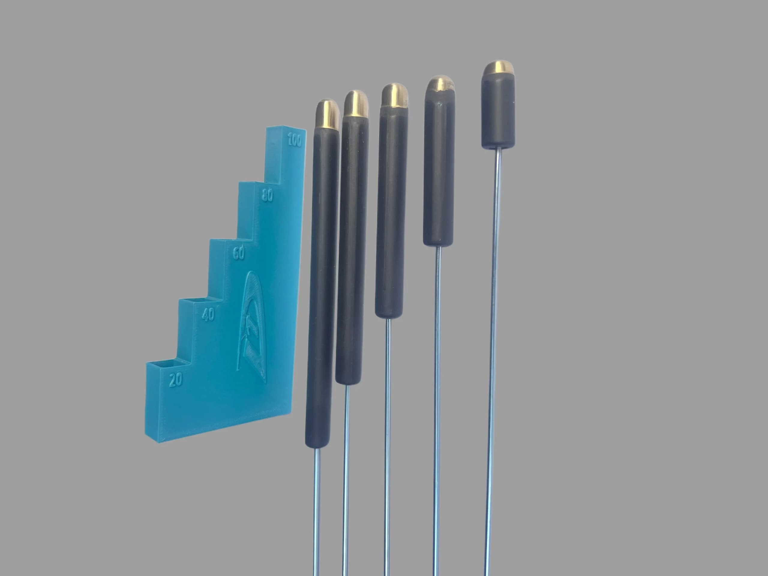 D1S ballast weights in different sizes with a turquoise holder